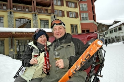 Skiers enjoy a sip of wine and a sleigh ride through the center of Sun Peaks village after skiing at icewine festival, Sun Peaks ski resort, BC, Canada. Photo by Yvette Cardozo, www.cardozohirsch.com