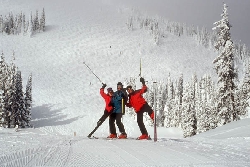 Skiers have fun in snow at Sun Peaks ski resort in British Columbia.. Expert Headwall run is behind them. Photo by Yvette Cardozo, www.cardozohirsch.com